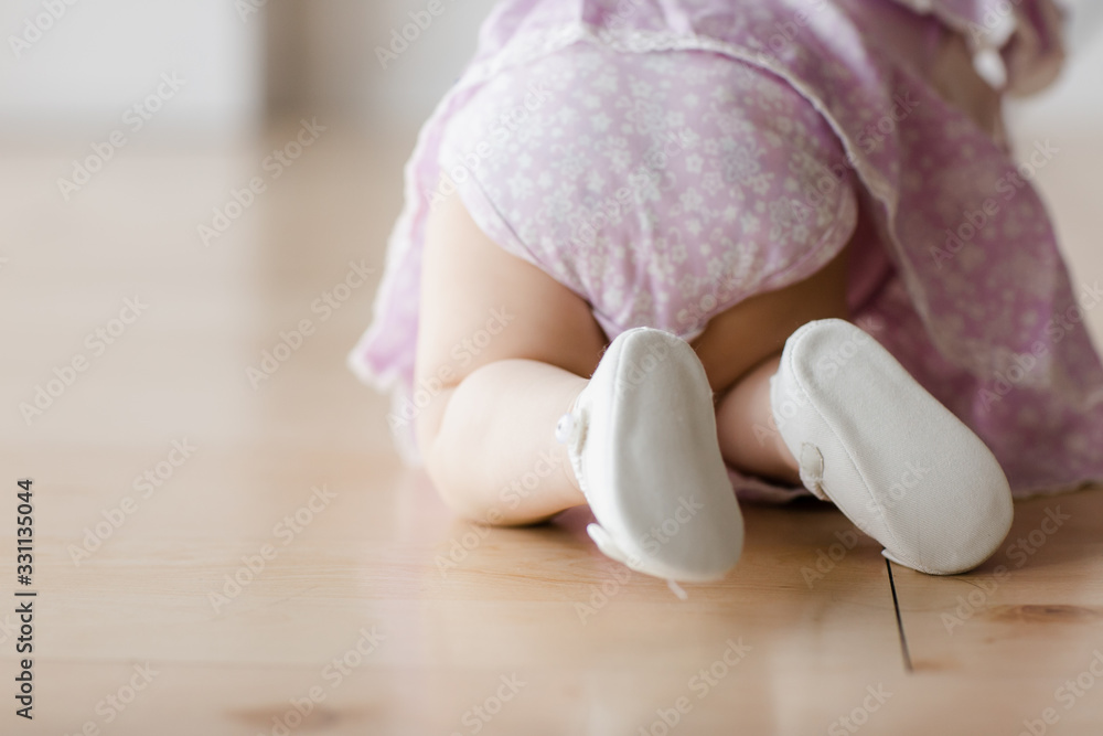 Funny crawling baby girl. Happy family concept Funny crawling baby girl. Happy family concept