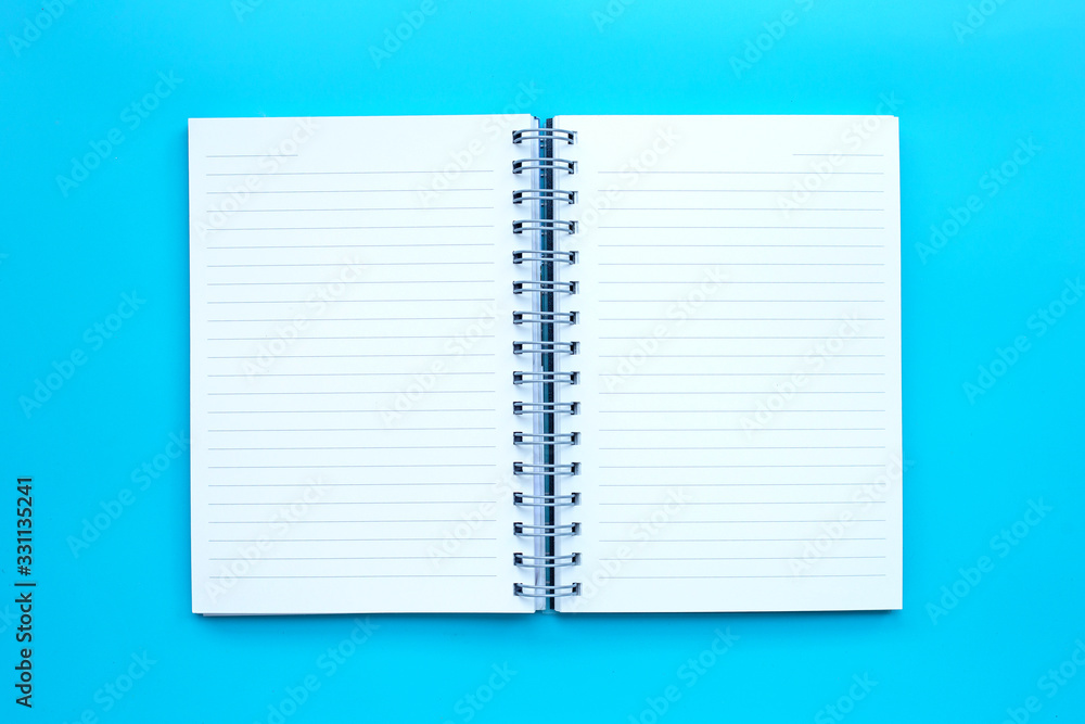 Open diary on blue background. Open diary on blue background.