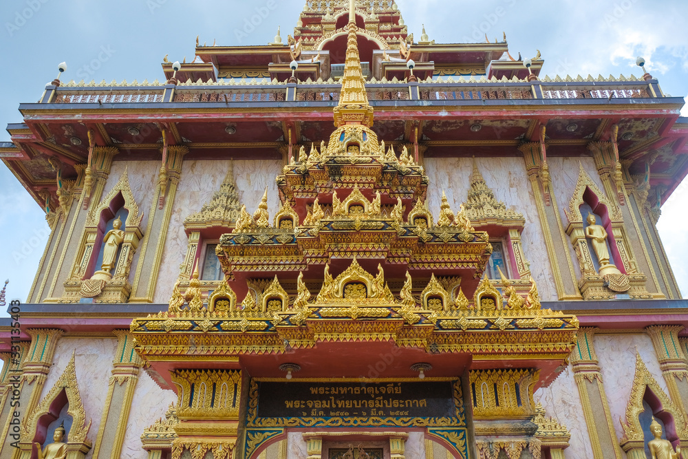 Buddhist temple with Buddha statues on a green background. Buddhist temple with Buddha statues on a green background.