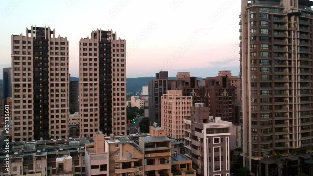 Cityscape and establishing shot of Zhubei and riverside park, right pan of city and park in Taiwan Cityscape and establishing shot of Zhubei and riverside park, right pan of city and park in Taiwan