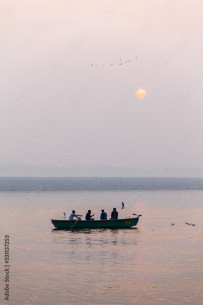People on a boat on the Holy Ganges river in Varanasi