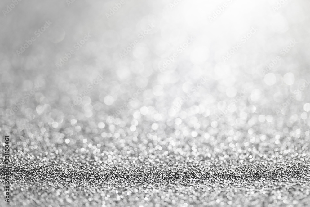Abstract blurred soft lighting bokeh effect on gray glitter floor Abstract blurred soft lighting bokeh effect on gray glitter floor