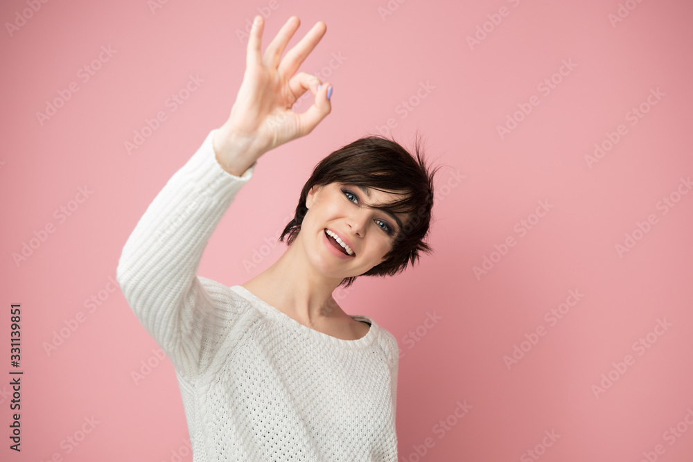 Female portrait with positive expressions and ok gesture. Beautiful young woman happy and excited expressing winning gesture. Successful and celebrating victory, triumphant, studio shot over pink Female portrait with positive expressions and ok gesture. Beautiful young woman happy and excited expressing winning gesture. Successful and celebrating victory, triumphant, studio shot over pink