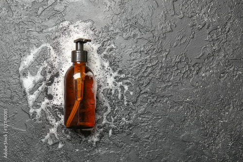Bottle of shampoo on dark background