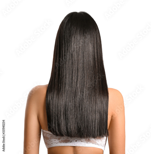 Young Asian woman with beautiful long hair on grey background
