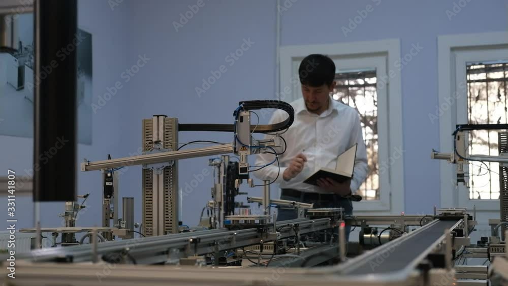 Industry 4.0 concept; Engineer is working at smart factory prototype. automated car on production line, artificial intelligence in smart manufacturing. Industry 4.0 concept; Engineer is working at smart factory prototype. automated car on production line, artificial intelligence in smart manufacturing.
