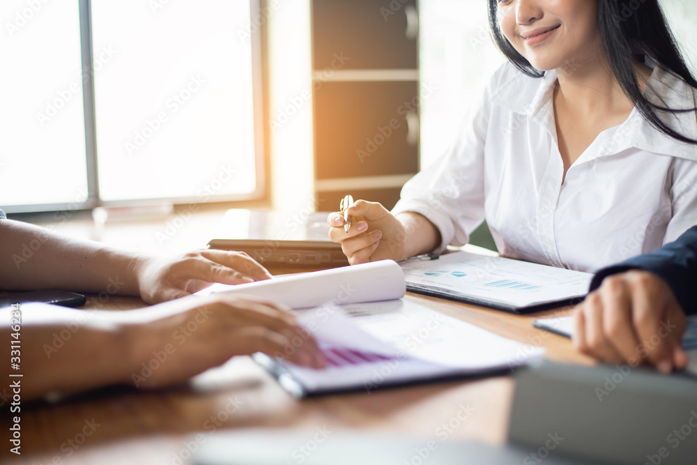 Teamwork with two business people in office with business analysis stock photo Teamwork with two business people in office with business analysis stock photo