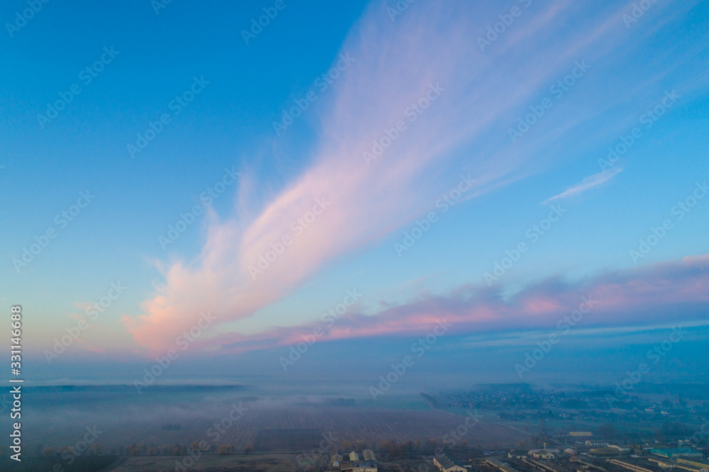 Early misty morning. Sunrise in countryside. Rural landscape in early spring. Aerial view