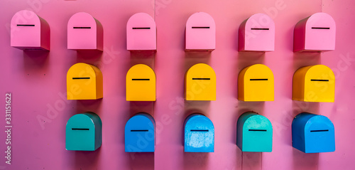 Photography Red, yellow and blue postbox mailboxes