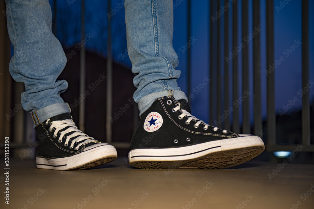 Young man wearing brand new Converse Chuck Taylor Stock Photo | Adobe Stock