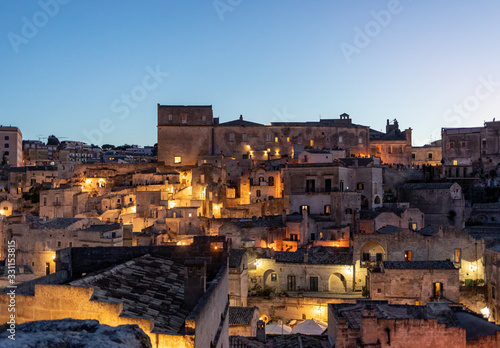 Night landscape of the Sassi of Matera a historic district iin the city of Matera well-known for their ancient cave dwellings. Basilicata. Italy