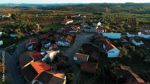 Wallpaper Mural Aerial slow pan up of the quaint village of Outeiro, Portugal, sunset, rolling hills, vineyards, traditional white houses with red slate roofs Torontodigital.ca
