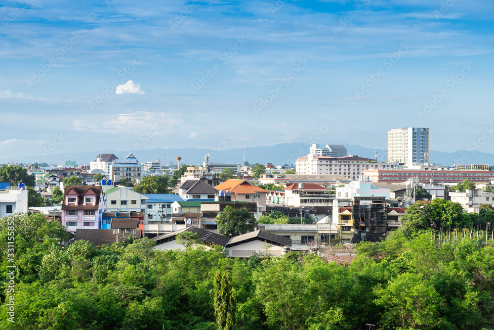 landscape view of cityscape over the Country town city and skyscrapers with mountains background of Chiang Mai, Thailand at daytime.