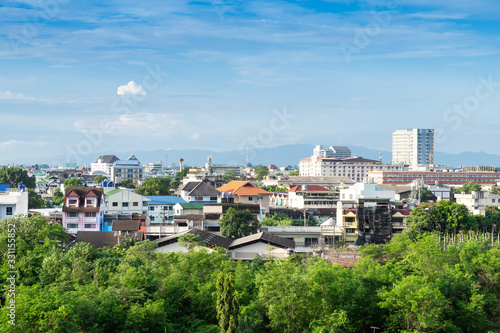 landscape view of cityscape over the Country town city and skyscrapers with mountains background of Chiang Mai, Thailand at daytime. © Thinapob