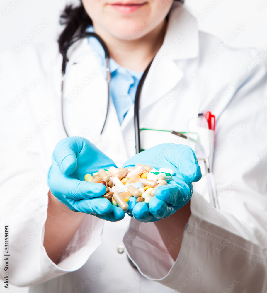 Female doctor hand holding of different tablet, closeup. Medicine and health care concept. Female doctor hand holding of different tablet, closeup. Medicine and health care concept.
