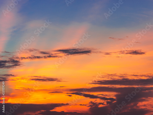 Bright orange and yellow colors sunset sky background © boonsom