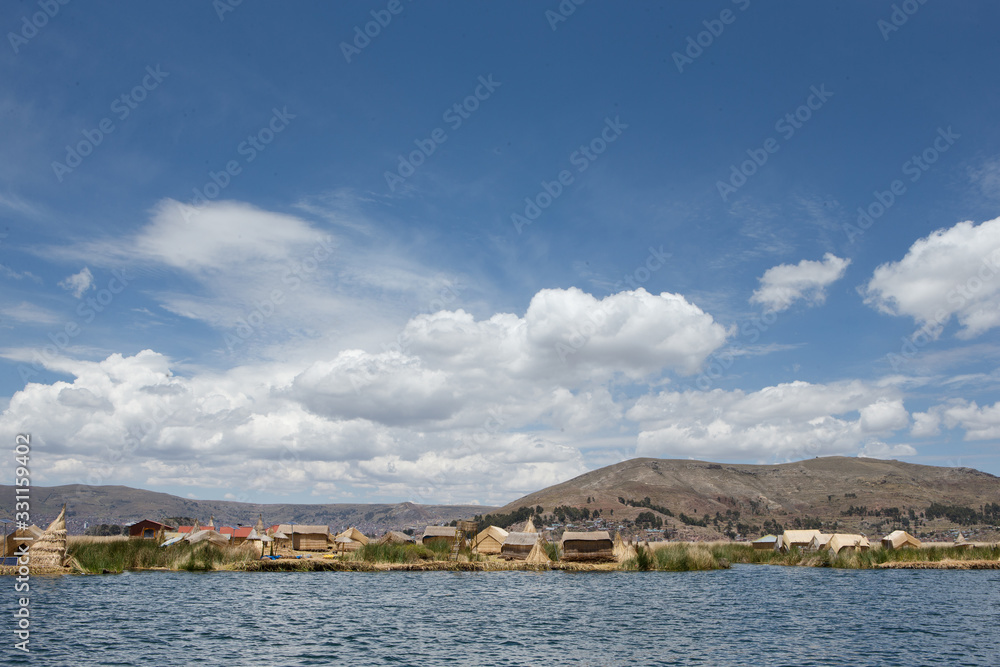 Puno Peru. Lake Titicaca. Floating village. Uros people. Reed culture. Reed houses.