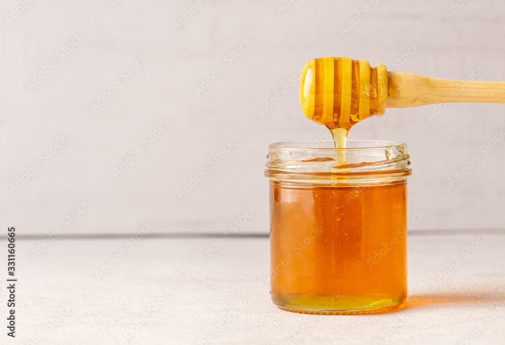 Honey jar, pot, honey spoon. Health. immunity. Isolated. Copy space. Honey jar, pot, honey spoon. Health. immunity. Isolated. Copy space.