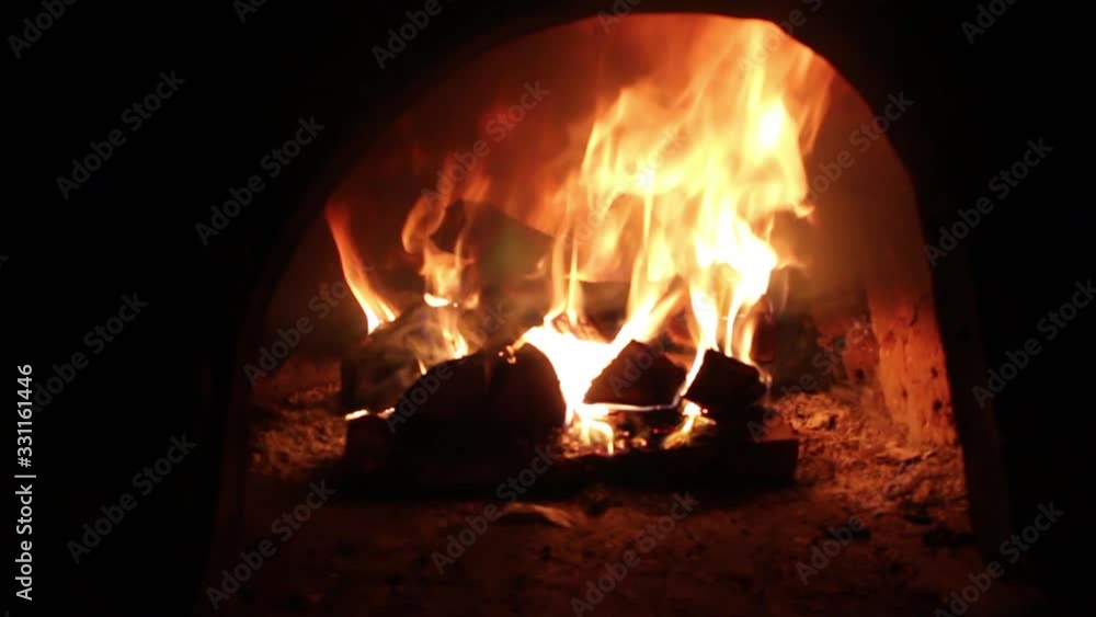 Yellow hot fire burns in the stove Yellow hot fire burns in the stove