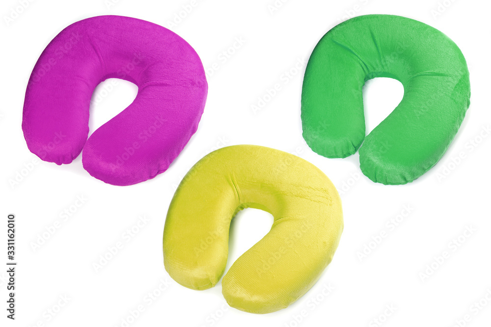 Three neck pillows of different colors isolated on white background Three neck pillows of different colors isolated on white background