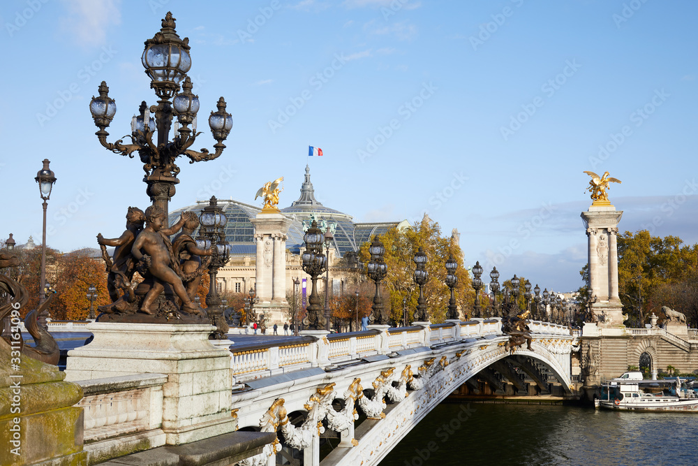 Alexandre III bridge in a sunny autumn day in Paris, France