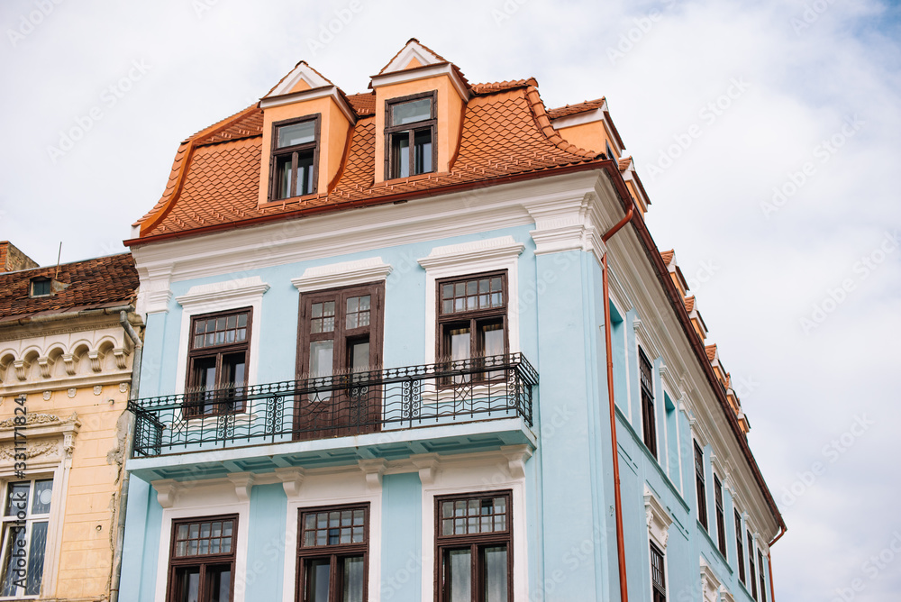 Fototapeta premium Brasov, Romania, 4 march 2020, photo of beautiful old blue house, medieval architecture