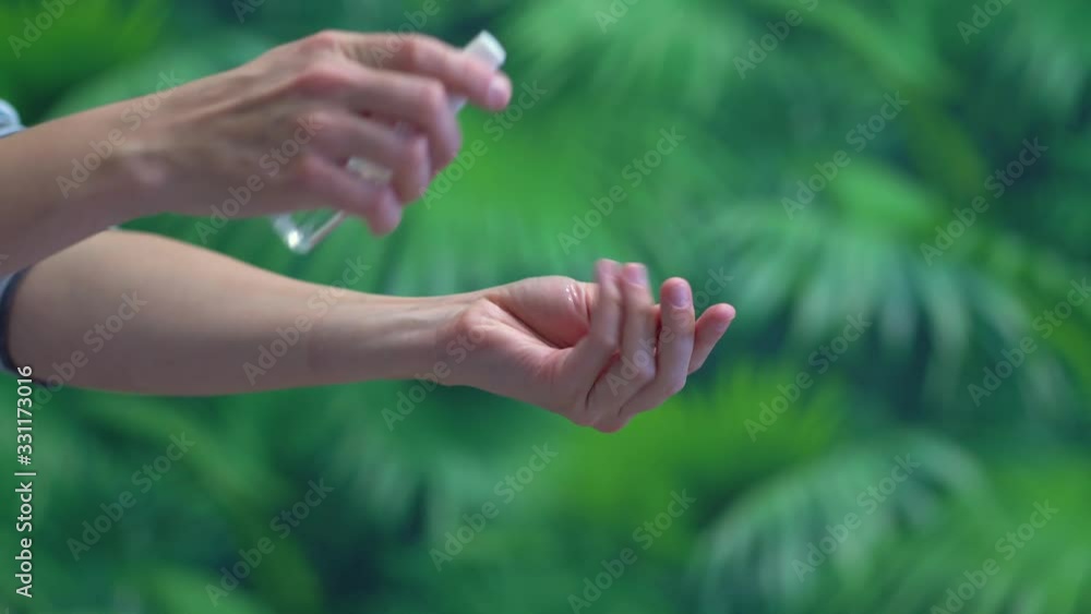 Close up hands of woman that applying sanitizer dispenser to make cleaning from germ, bacteria, virus. Health care concept. Close up hands of woman that applying sanitizer dispenser to make cleaning from germ, bacteria, virus. Health care concept.