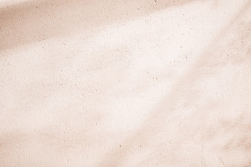 Clay eco-plaster texture. Sunny spring and summer rustic background