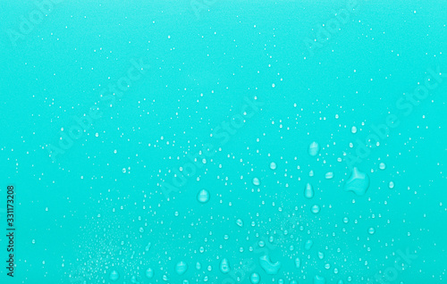 Drops of water on a color background. Blue. Toned