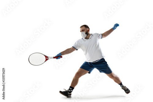 Beat the disease. Male tennis player in protective mask and gloves. Prevention against pneumonia. Still active while quarantine. Chinese coronavirus treatment. Healthcare, medicine, sport concept. © master1305