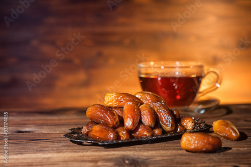 Quadro su tela dates and cup of tea, concept of muslim feast holy month Ramadan Kareem, copy sp