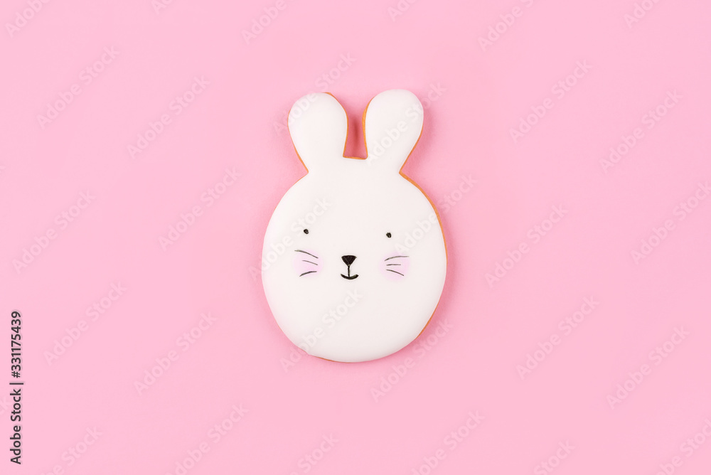 Fototapeta premium Easter bunny cookies on pink background. Spring holiday.