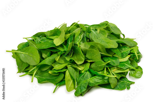 Fresh spinach leaves as background.