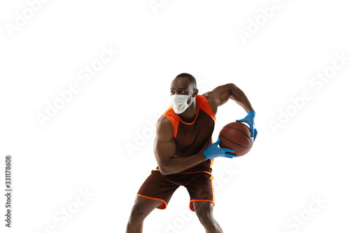 Beat it off. African-american basketball player in protective mask. Prevention against pneumonia. Still active while quarantine. Chinese coronavirus treatment. Healthcare, medicine, sport concept.