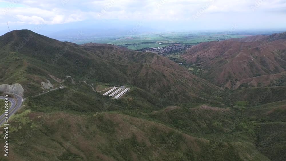 Valle De Cauca, Colombia. Mountain road with green forest on the background. Aerial top video. Car ride on the mountain road. Valle De Cauca, Colombia. Mountain road with green forest on the background. Aerial top video. Car ride on the mountain road.