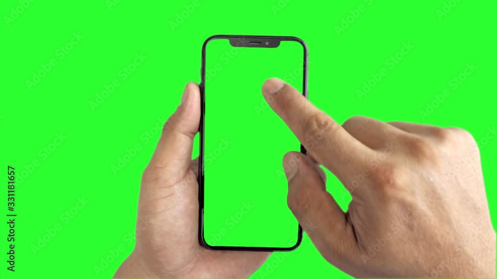 Man's hand holding a black smartphone with green screen slide up and slide down display, Man using mobile phone with chroma key touch display on green background. Man's hand holding a black smartphone with green screen slide up and slide down display, Man using mobile phone with chroma key touch display on green background.