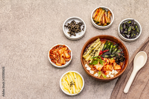 Traditional Korean spicy soup with kimchi, tofu, vegetables. Hot dish for healthy meal