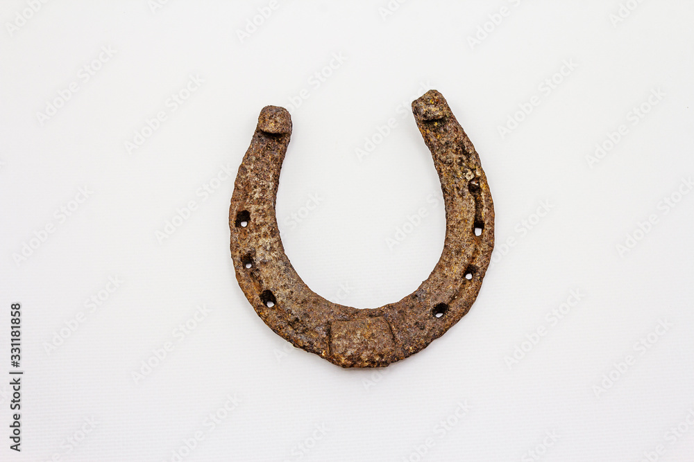 Cast iron metal horse horseshoe isolated on white background Cast iron metal horse horseshoe isolated on white background