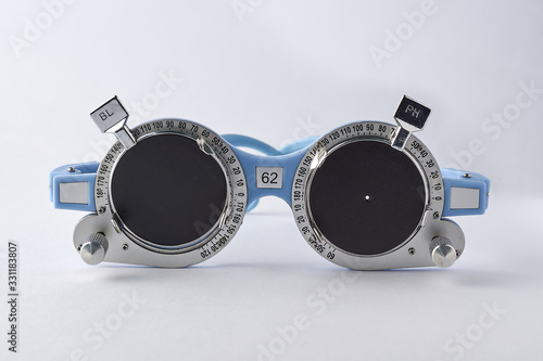 Optometrist medical equipment of pinhole on trial frame test, Equipment tool for test vision isolated on white background. photo