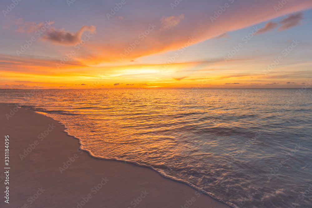 Closeup of sand on beach and blue summer sky. Panoramic beach landscape. Empty tropical beach and seascape. Orange and golden sunset sky, soft sand, calmness, tranquil relaxing sunlight, summer mood Closeup of sand on beach and blue summer sky. Panoramic beach landscape. Empty tropical beach and seascape. Orange and golden sunset sky, soft sand, calmness, tranquil relaxing sunlight, summer mood