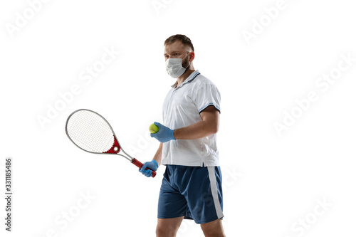 Win points off disease. Male tennis player in protective mask, gloves. Prevention against pneumonia. Still active while quarantine. Chinese coronavirus treatment. Healthcare, medicine, sport concept.