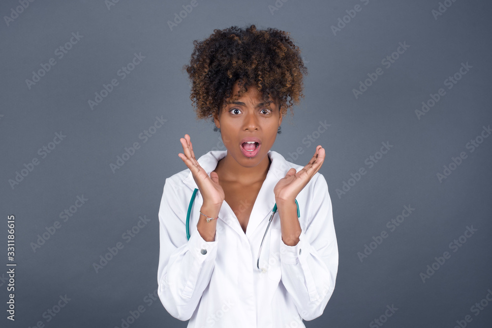 Surprise concept. Portrait of astonished beautiful doctor girl looking surprised in full disbelief wide open mouth with hands near face. Positive emotion facial expression body language. Surprise concept. Portrait of astonished beautiful doctor girl looking surprised in full disbelief wide open mouth with hands near face. Positive emotion facial expression body language.