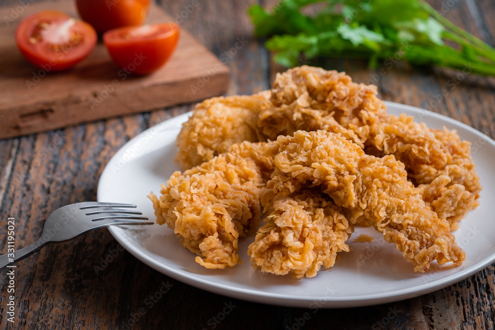 Crispy fried breaded chicken strips on plate . Crispy fried breaded chicken strips on plate .