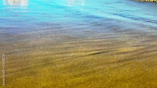 Beach sand and blue sea wave slow motion