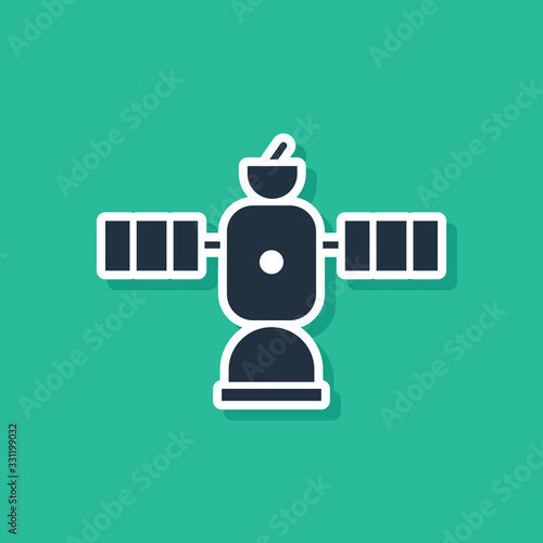 Blue Satellite icon isolated on green background. Vector Illustration