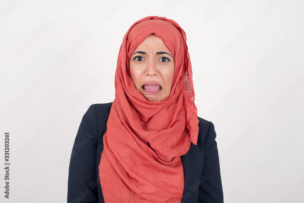 Negative human expressions and attitude. Angry dissatisfied female has disgusting expression as sees something not appealing, frowns face, isolated over white background. Distaste and dislike Negative human expressions and attitude. Angry dissatisfied female has disgusting expression as sees something not appealing, frowns face, isolated over white background. Distaste and dislike