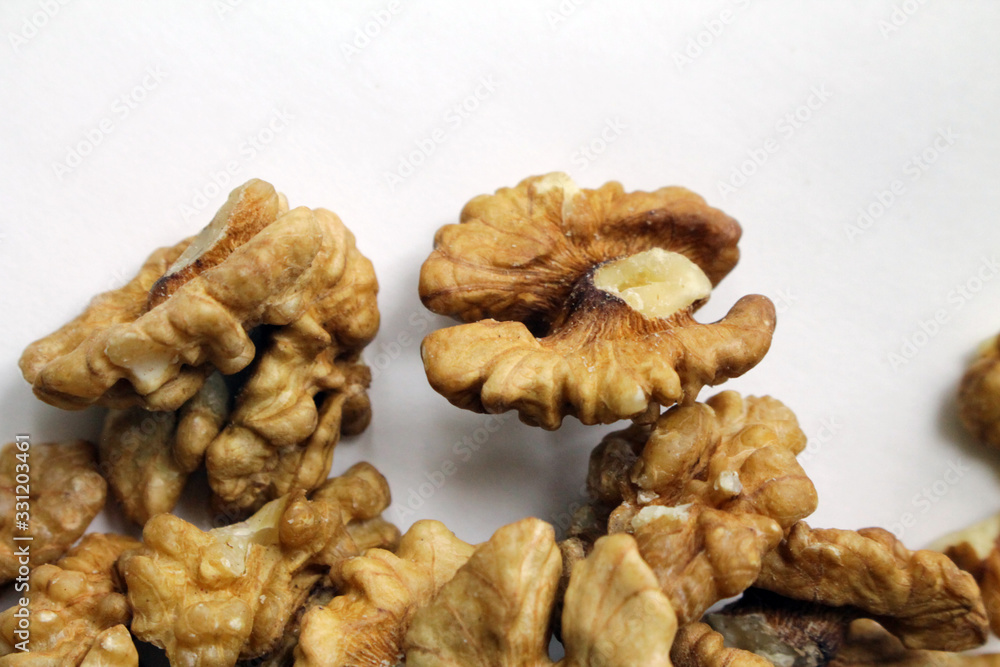 Peeled walnuts on a white background. Tasty and healthy. Peeled walnuts on a white background. Tasty and healthy.