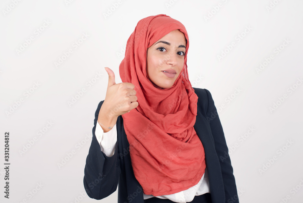 Good job! Portrait of a happy smiling blue eyed young successful woman giving thumb up gesture standing outdoors. Positive human emotion facial expression body language. Funny girl Good job! Portrait of a happy smiling blue eyed young successful woman giving thumb up gesture standing outdoors. Positive human emotion facial expression body language. Funny girl