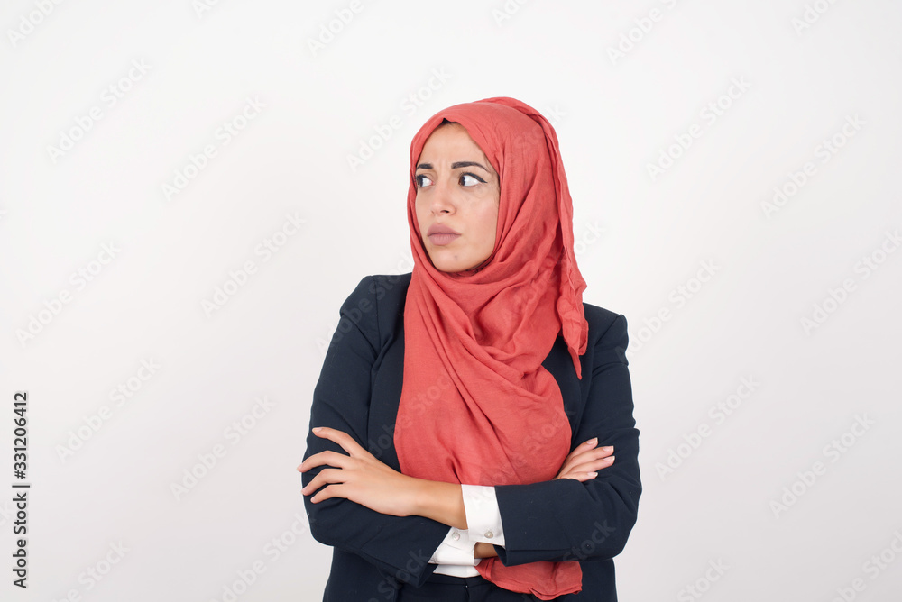 Closeup portrait displeased pissed off angry grumpy pessimistic woman with bad attitude, arms crossed looking sideways. Negative human emotion facial expression feelings Closeup portrait displeased pissed off angry grumpy pessimistic woman with bad attitude, arms crossed looking sideways. Negative human emotion facial expression feelings