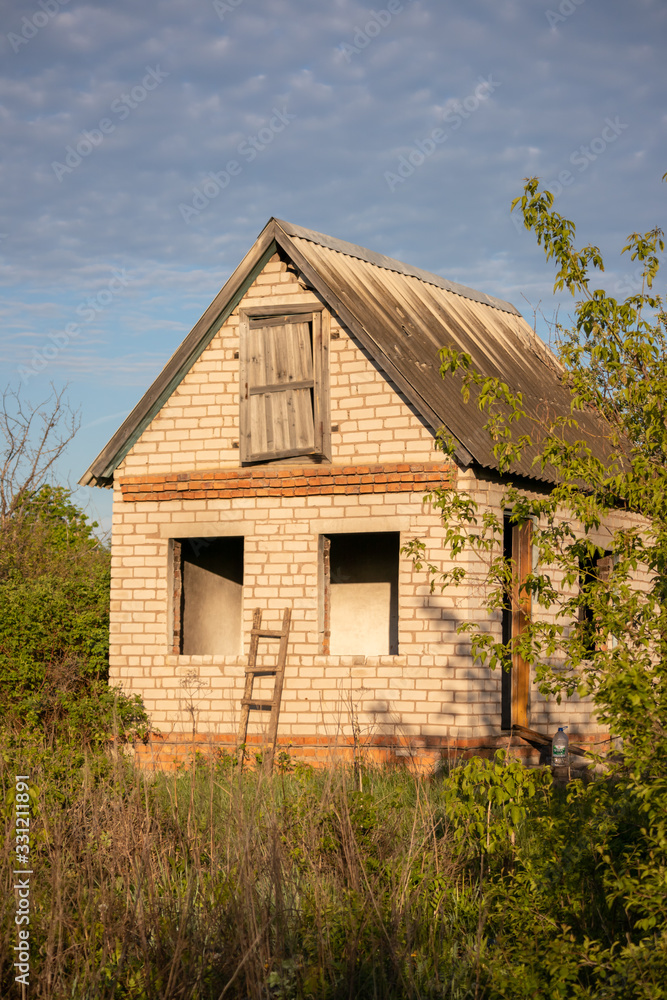 Old Abandoned brick house in garden